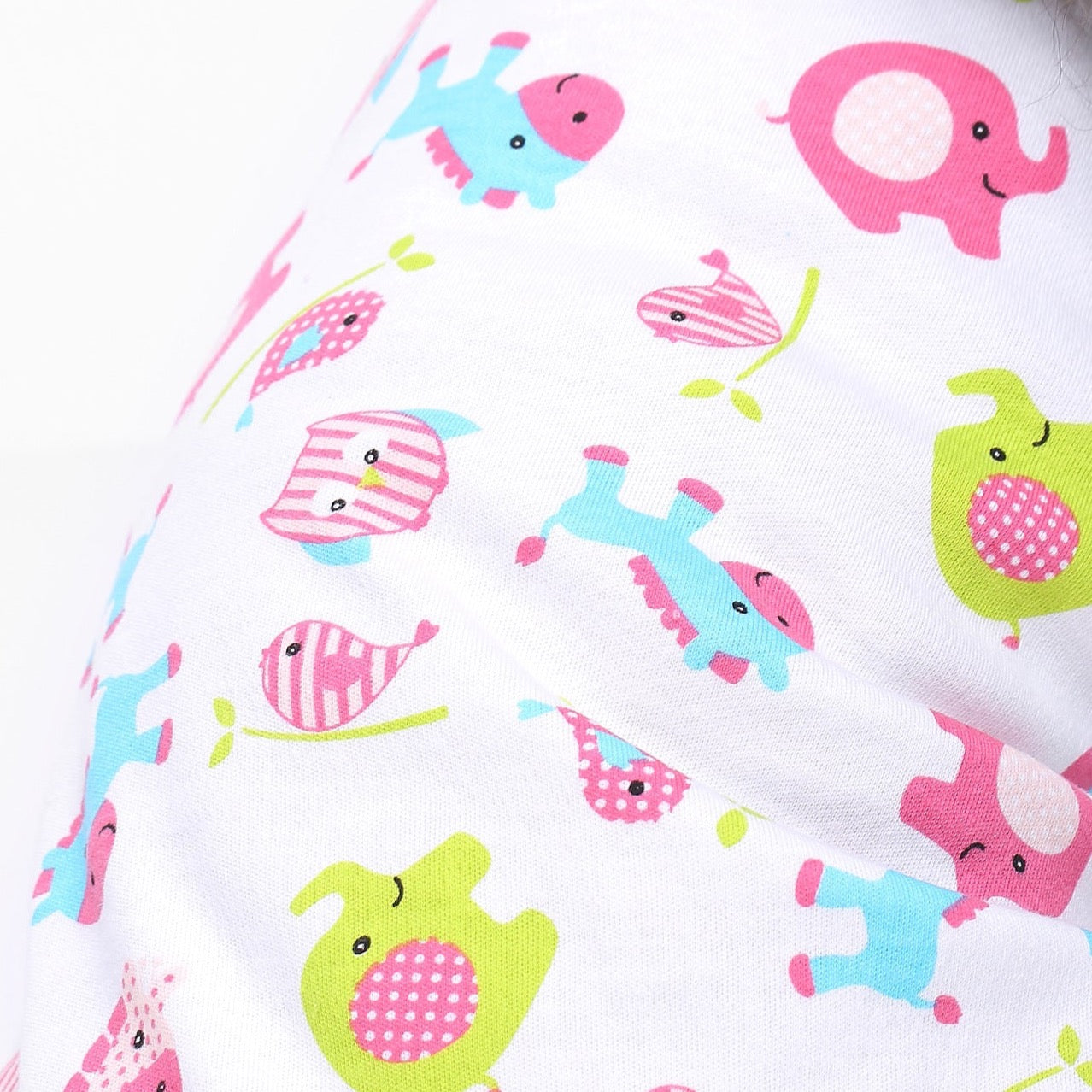 Lime green, baby blue and pink multi-colored animal prints on white fabric
